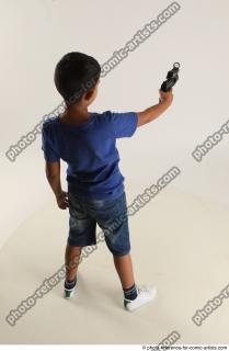 TIMBO STANDING POSE WITH GUN